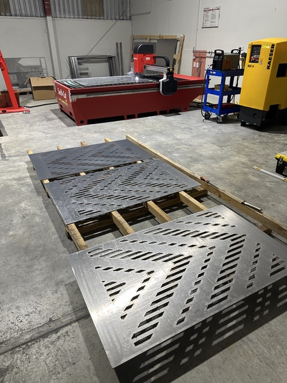 Stacked perforated concrete panels in the studio yard