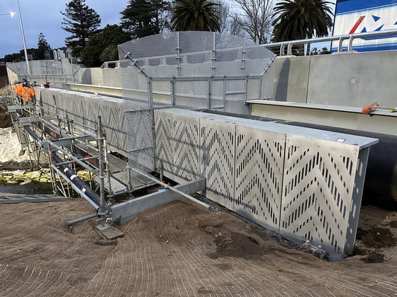 Patterned cast-concrete panels forming a low sited structure